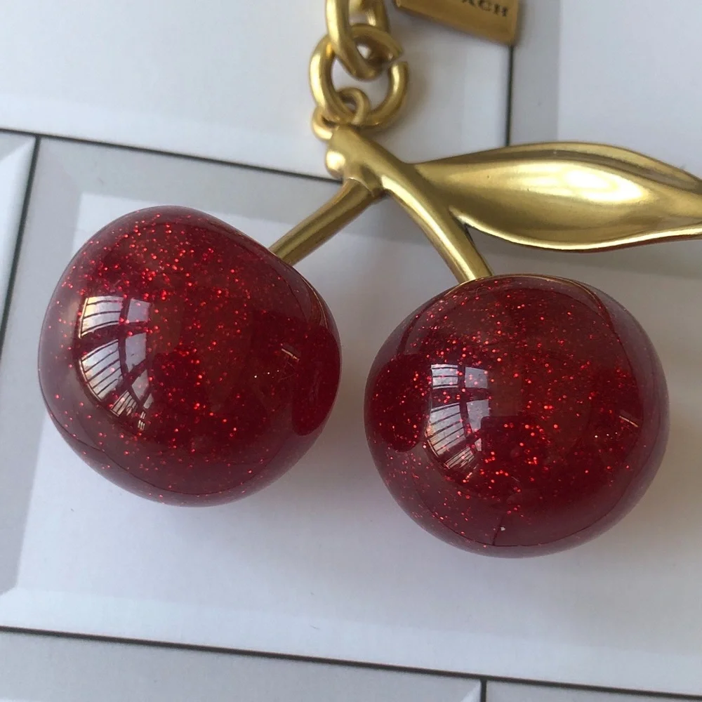 Coach Gold-Tone Cherry Keychain with Red Glitter Cherries - Picture 3 of 4